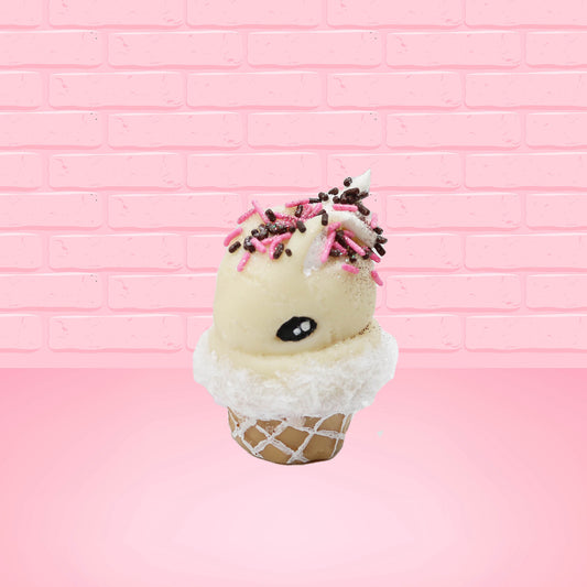 Cute kawaii bunny white ice cream cone Vanilla Pink Sprinkle with black and pink sprinkles on top with a swirl of whipped cream. This view is from the side at an angle.