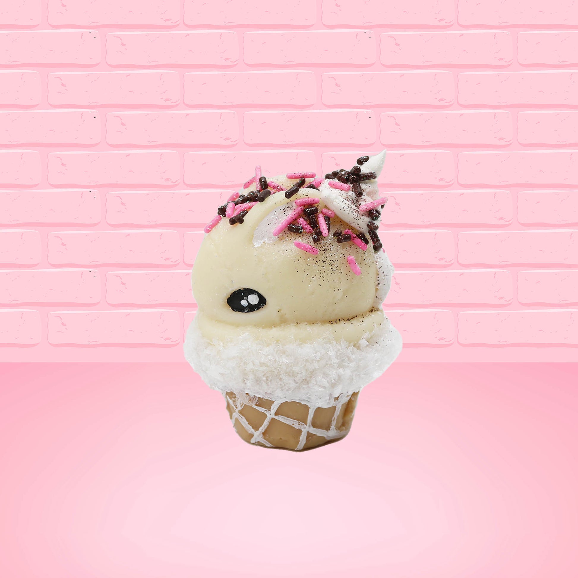 Cute kawaii bunny white ice cream cone Vanilla pink Sprinkle with black and pink sprinkles on top with a swirl of whipped cream. This view is from the side.