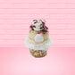 Cute kawaii bunny white ice cream cone Vanilla pink Sprinkle with black and pink sprinkles on top with a swirl of whipped cream. This view is from the back.