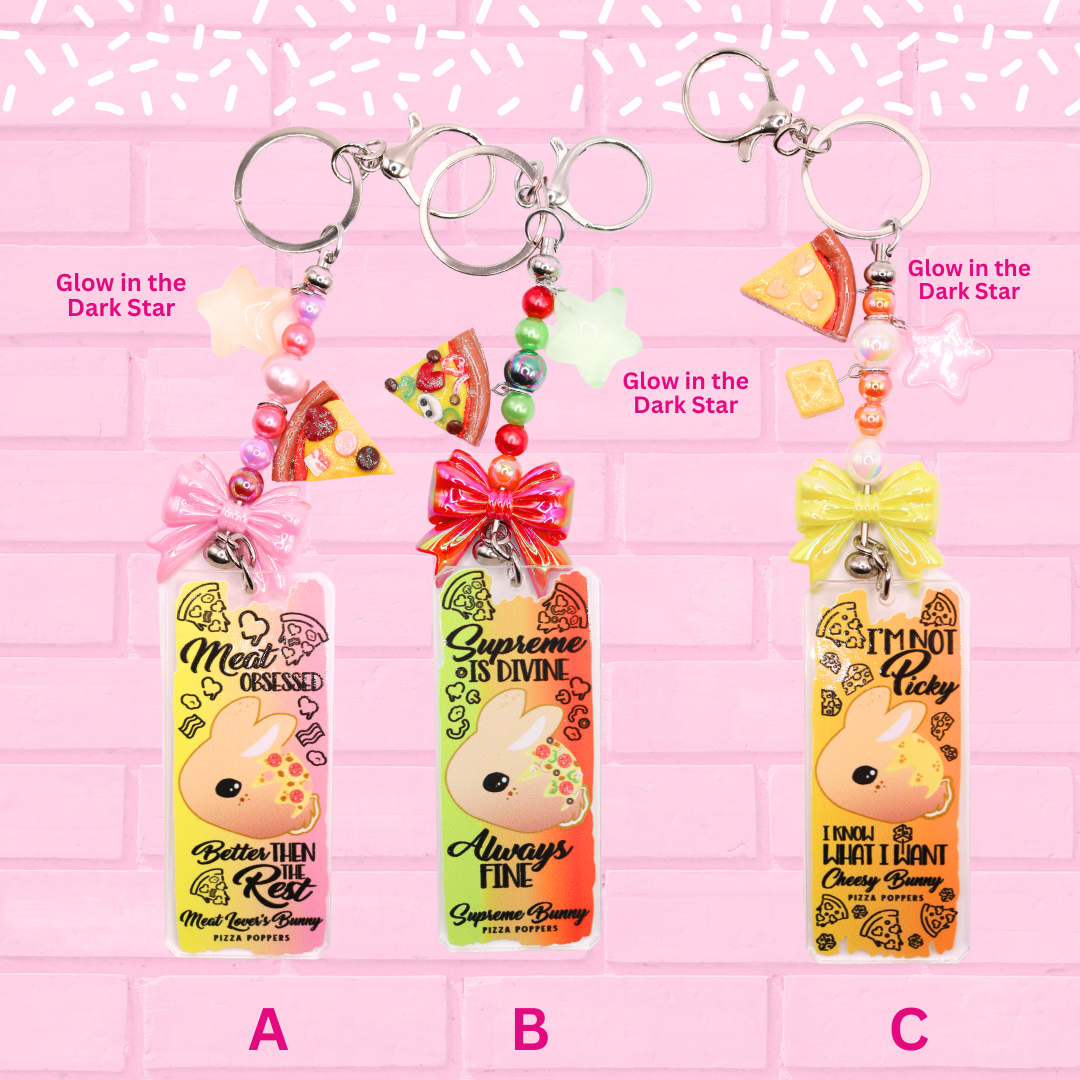Keychains A, B, C are shown which are Meat Lovers Bunny Poppers, Supreme Bunny Poppers, and Cheese Bunny Poppers. The words Bunny Keychains 3 inch large and Glow in the Dark Star are shown.