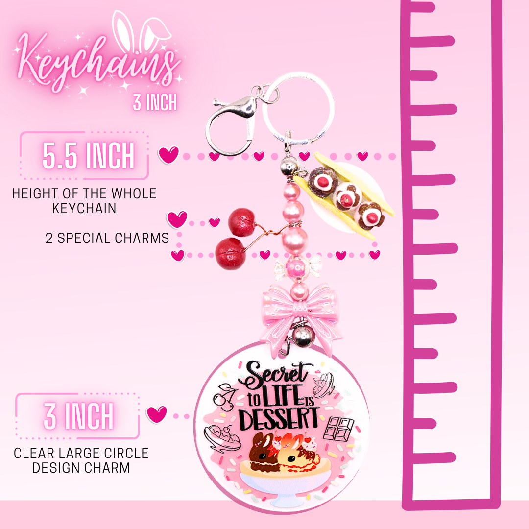 This shows the break down of the keychain, which shows the total length as 5.5 inches, 2 special charms to each keychain, and a 3 inch clear large circle design charm at the end.  A ruler on the side shows the overall length of the circle charm keychain.
