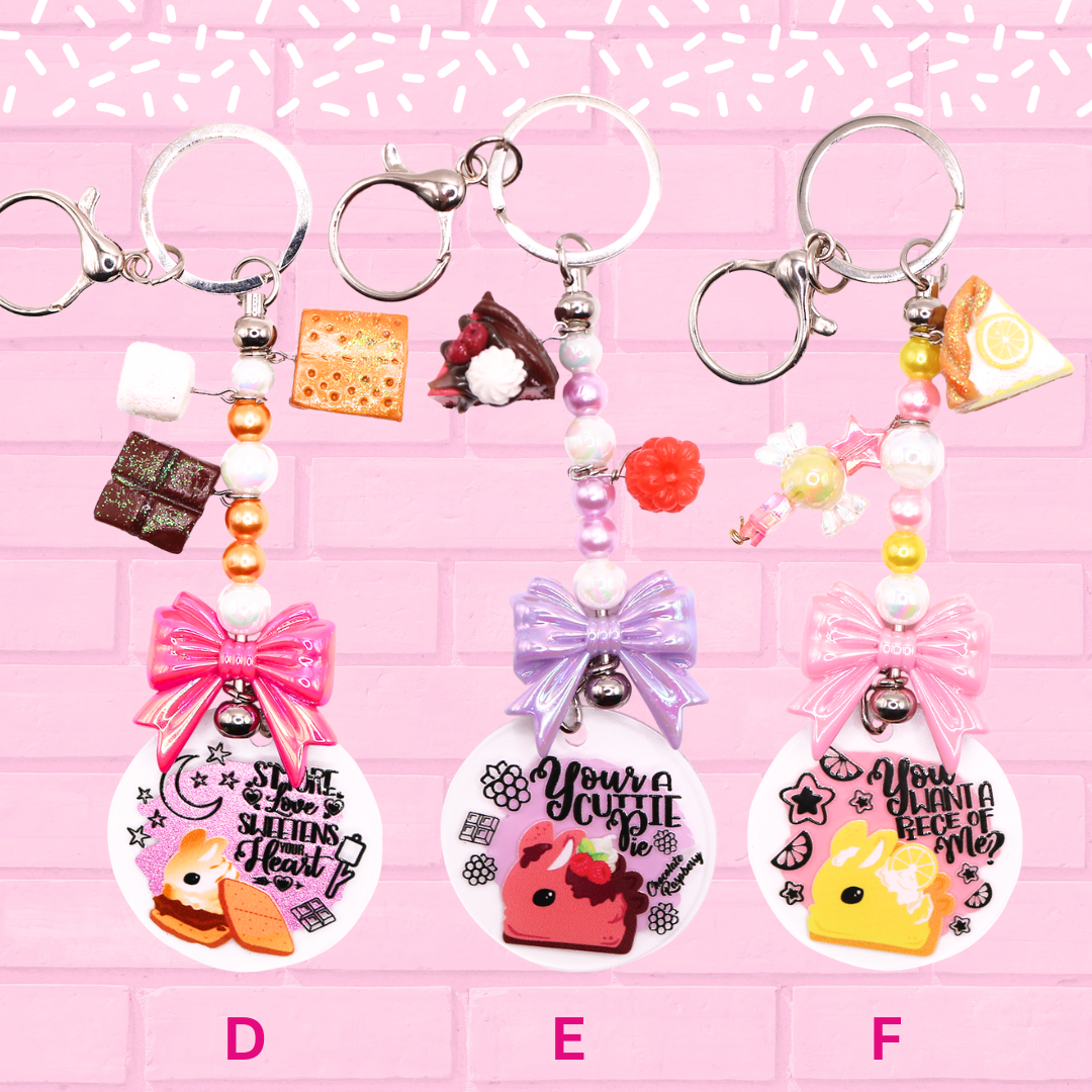 Keychain D, E, F are shown which are S’more bunny, Raspberry Chocolate Pie Bunny, and Lemon Meringue Pie Bunny.  The words Bunny Keychains Sweets & Treats 2 Inch : Medium are shown.