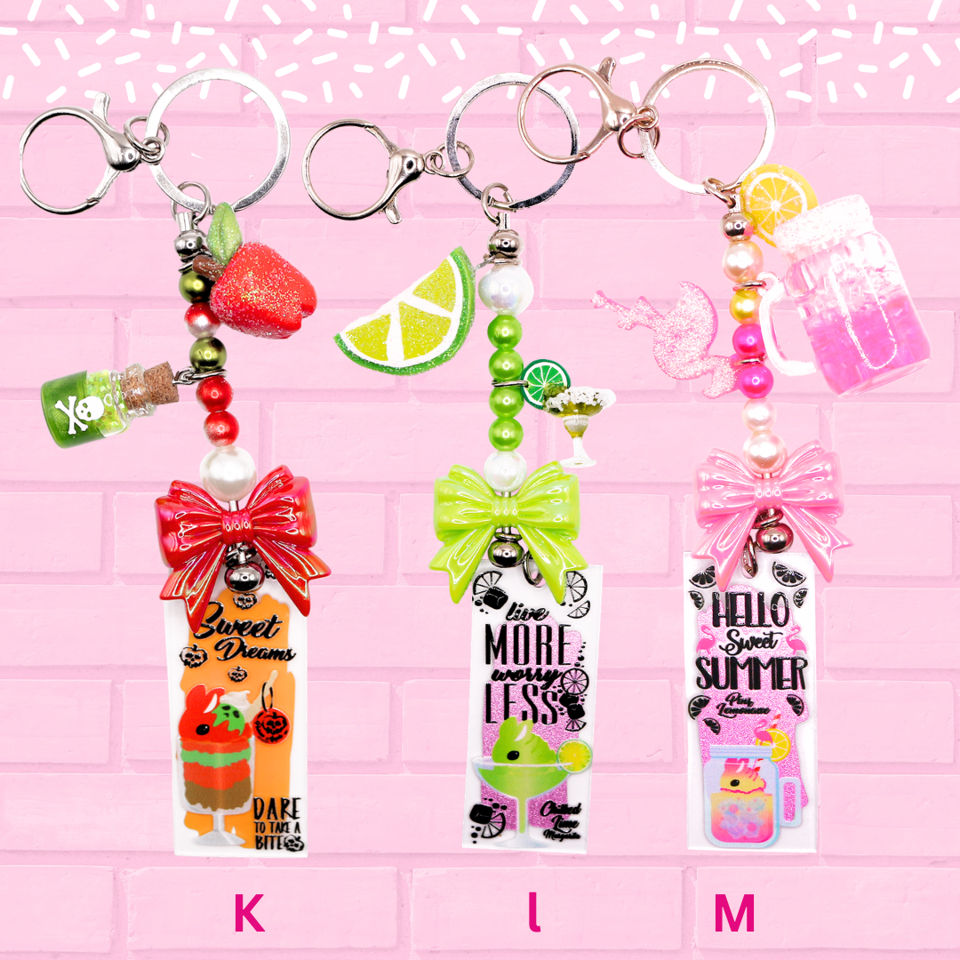 Keychain K, L, M are shown which are Poison Apple Bunny, Lime Margarita bunny, Pink Lemonade Bunny. The words Bunny Keychains Sweets & Treats 2 Inch : Medium are shown.