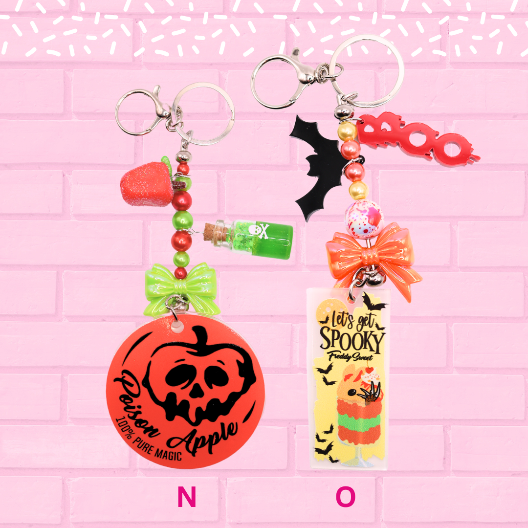 Keychain N and O are shown, which are Poison Apple tag, and Freddy. The words Bunny Keychains Sweets & Treats 2 Inch : Medium are shown.