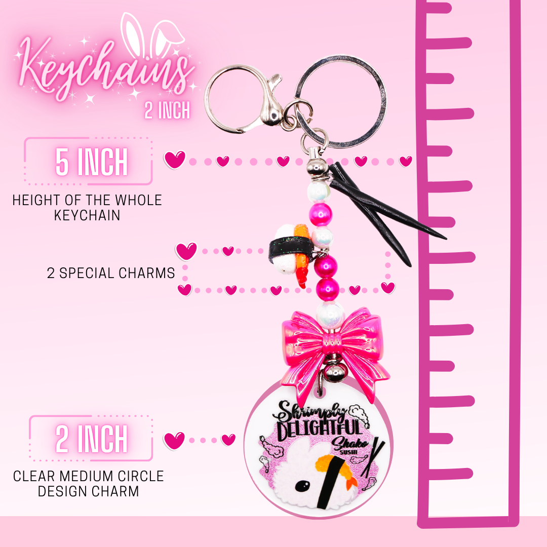 This shows the break down of the keychain, which shows the total length as 5 inches, 2 special charms to each keychain, and a 2 inch clear medium circle design charm at the end.  A ruler on the side shows the overall length of the circle charm keychain.