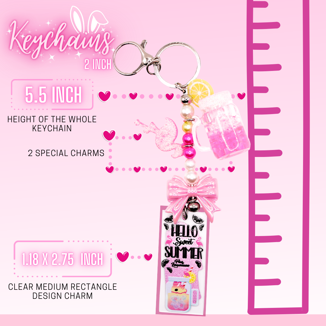 This shows the break down of the keychain, which shows the total length as 5.5 inches, 2 special charms to each keychain, and a 2.75 inch long clear rectangle design charm at the end.  A ruler on the side shows the overall length of the rectangle charm keychain.