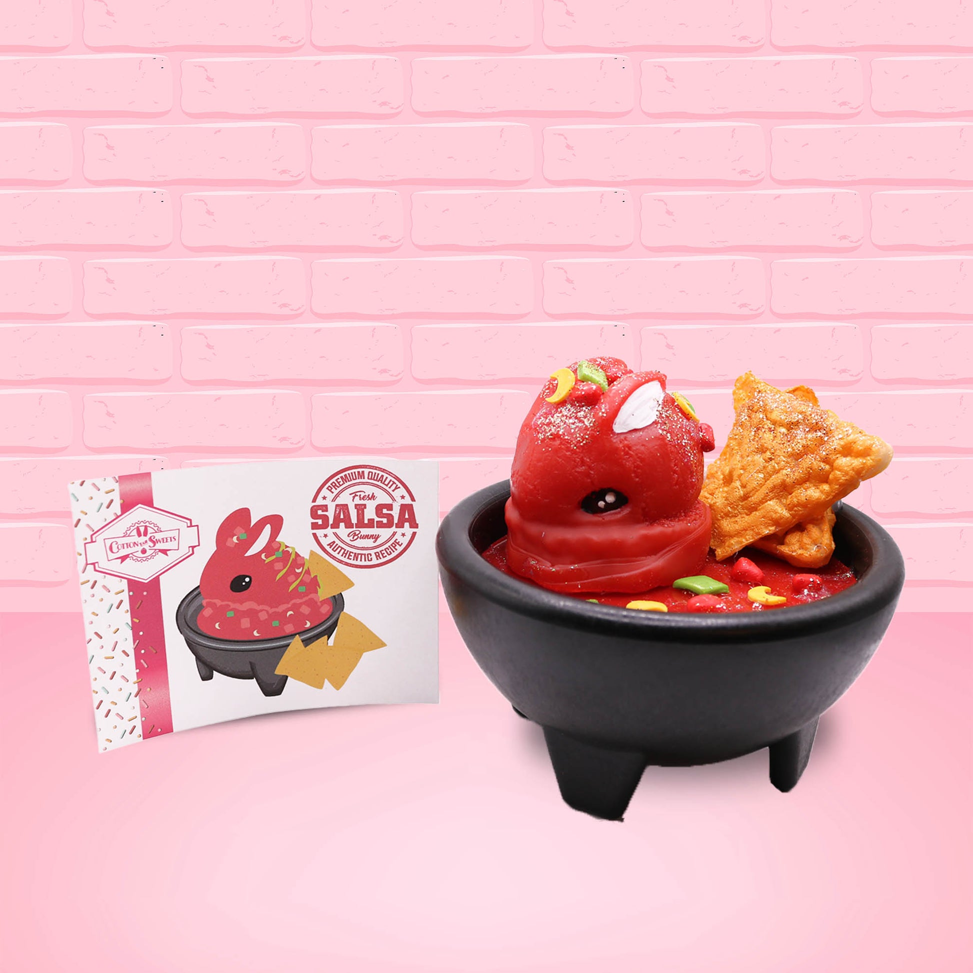Cute kawaii red bunny with chips in a bowl. The front of the character card is shown.