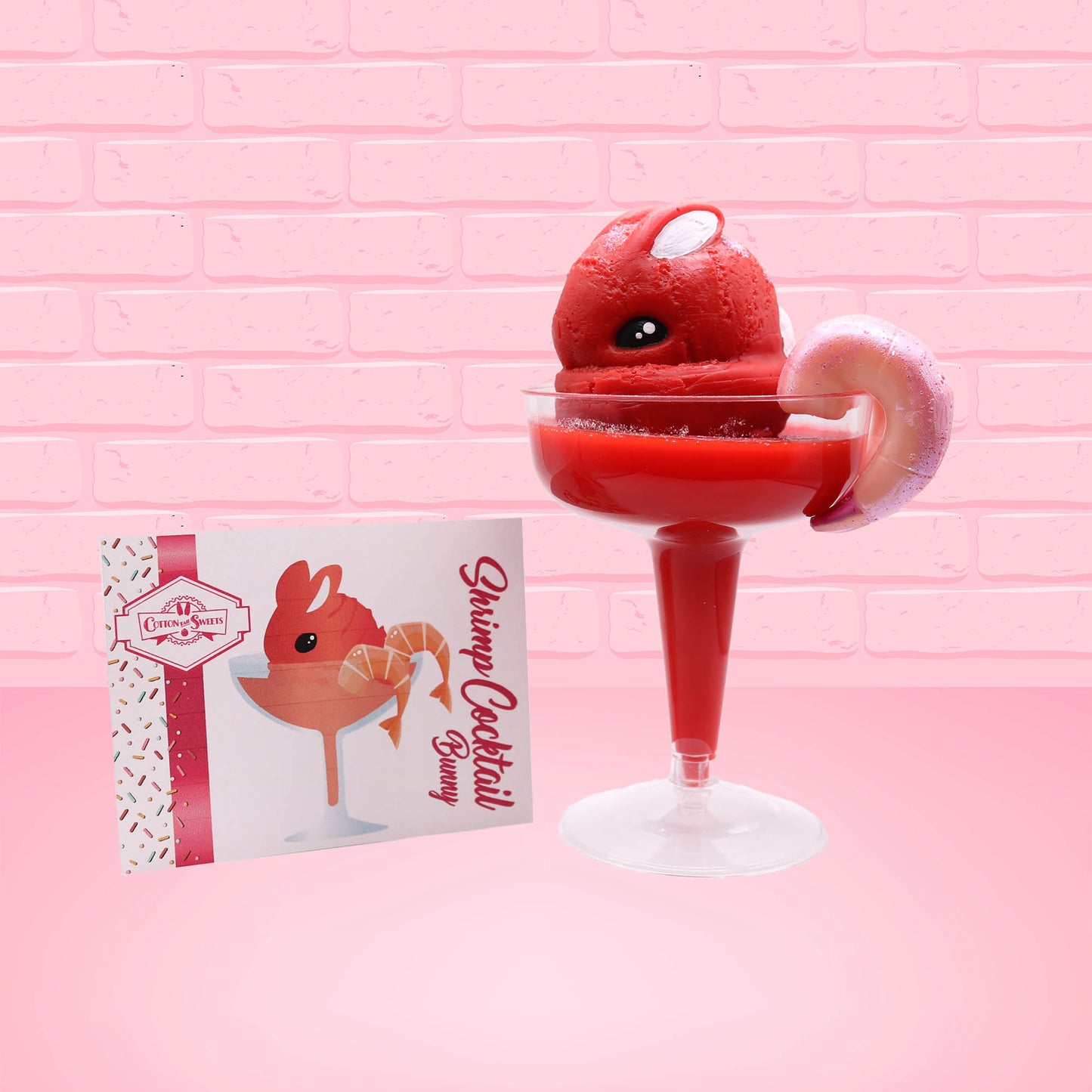 Cute kawaii red bunny in a dish with a shrimp on the rim. The front of the character card is shown as well.