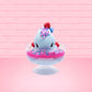 Cute kawaii Berry Swirl Cotton Candy blue ice cream sundae with pink glaze, pink blue and white sprinkles, strawberries and whipped cream swirls in the dish.  There are sprinkles, a blue berry, and strawberry on the top of the bunny near the swirl of the whipped cream. This view is from the front.
