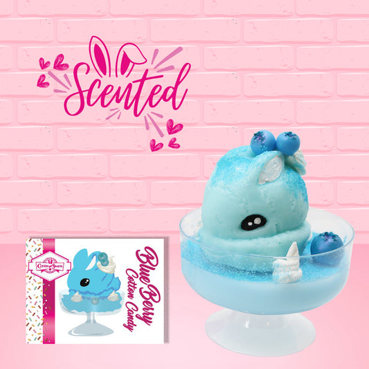 Cute kawaii Blue Berry Cotton Candy ice cream sundae with blue berries and swirls of whipped cream in the dish. The bunny has two blue berries on the top near the swirl of whipped cream on the back. The front of the character card is show, as well as the word scented. 