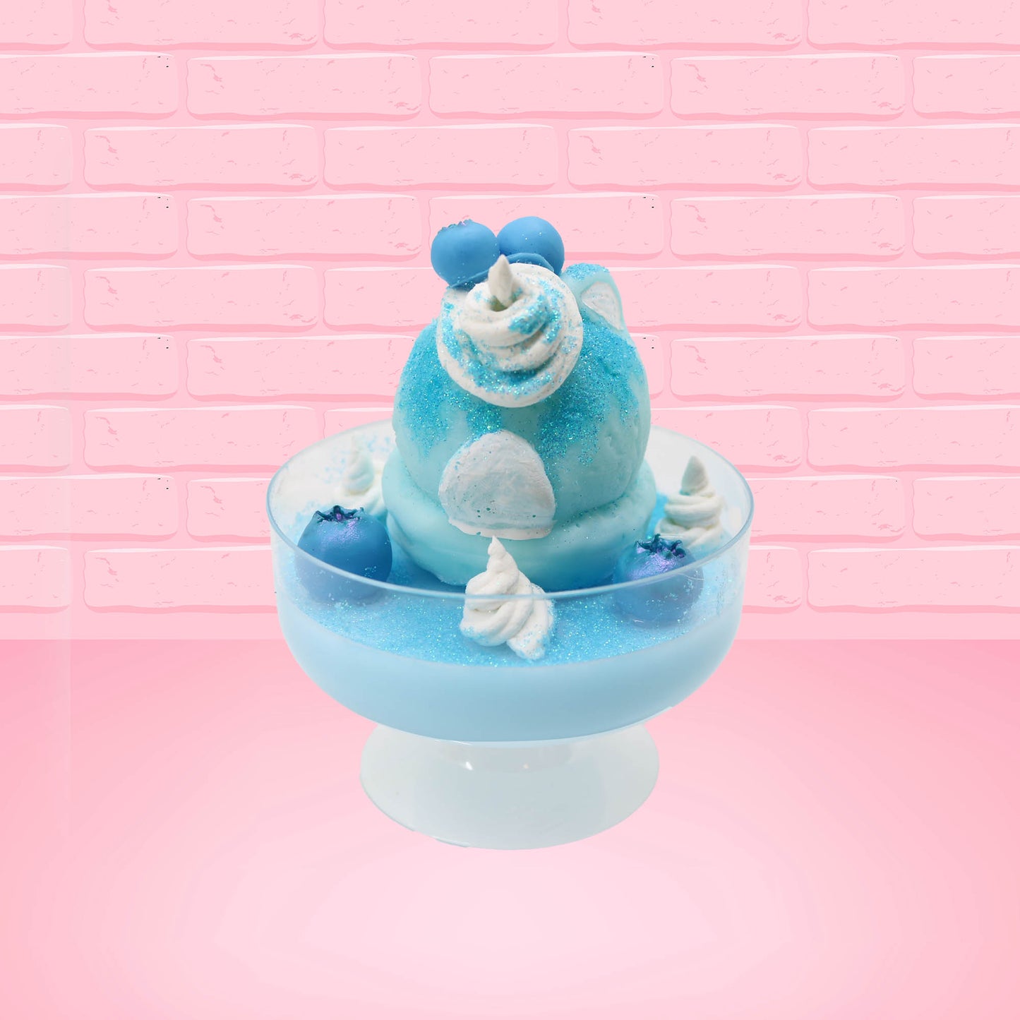 Cute kawaii Blue Berry Cotton Candy ice cream sundae with blue berries and swirls of whipped cream in the dish, while covered with blue glitter.  The bunny has two blue berries on the top near the swirl of whipped cream on the back. This view is from the back.