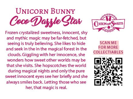 The back of the character card reads: Unicorn Bunny Coco Dazzle Star, Frozen crystalized sweetness, innocent, shy, and mythic magic may be far-fetched, but seeing is truly believing. She likes to hide and seek in the magical forest in the clouds. Giggling with her innocence, she wonders how sweet other worlds may be that she visits. She hopscotches the world during magical nights and only the pure sweet innocent eyes see her briefly and she always smiles back. Letting those who see her, that magic is real. 