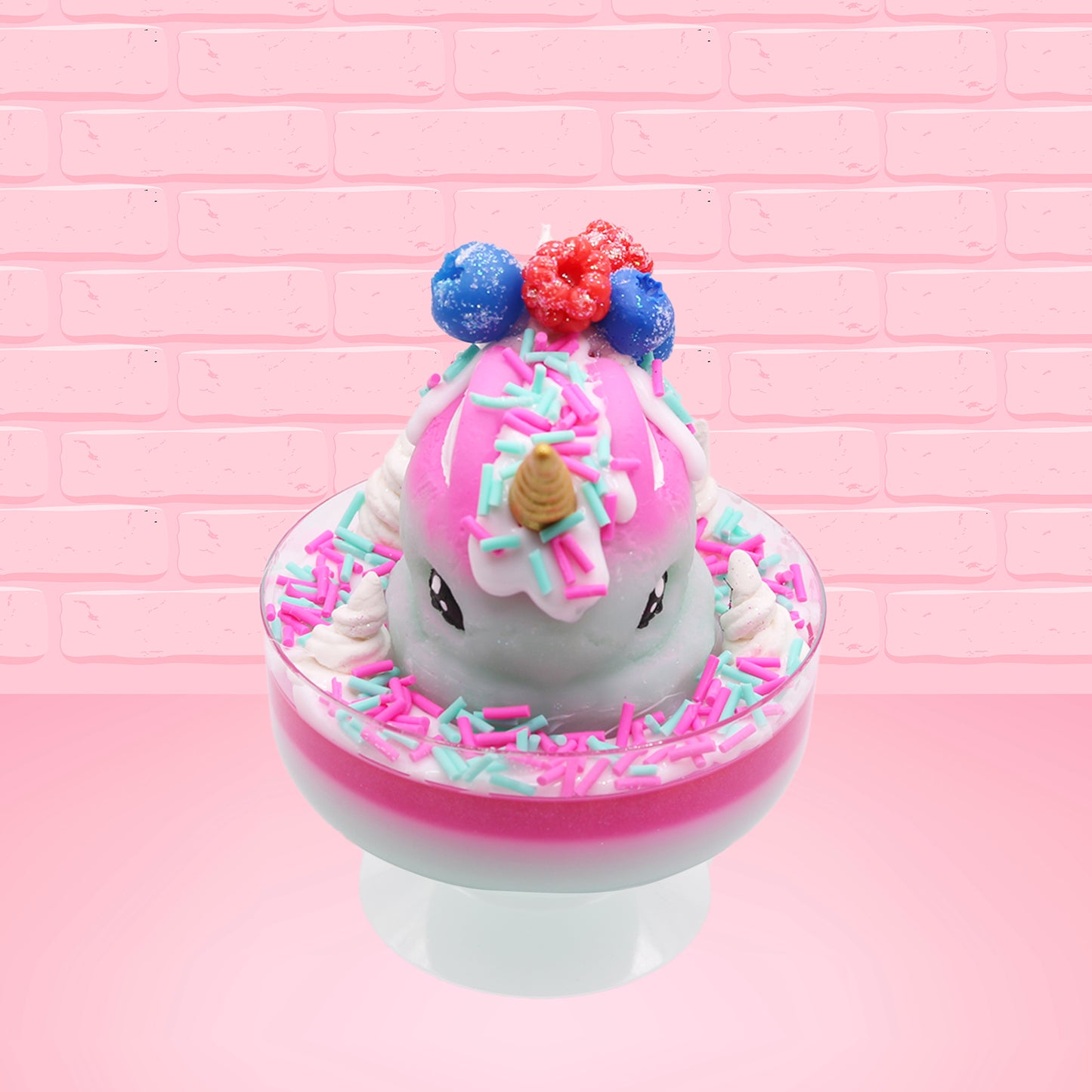 Cute kawaii unicorn bunny Irresistible Sugary Berry light blue and pink sundae with light blue and pink sprinkles with whipped cream swirls in the dish.  The unicorn bunny has blue berries and red raspberries on top near the whipped cream swirl with white drizzle coming down. This view is from the front.