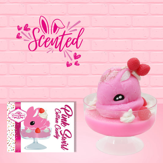 Cute kawaii bunny Pink Swirl Cotton Candy pink ice cream sundae with strawberries and swirls of whipped cream in the dish. The bunny has two strawberries near the swirl of whipped cream on top and white glitter.  The front of the character card and the word scented is shown as well.