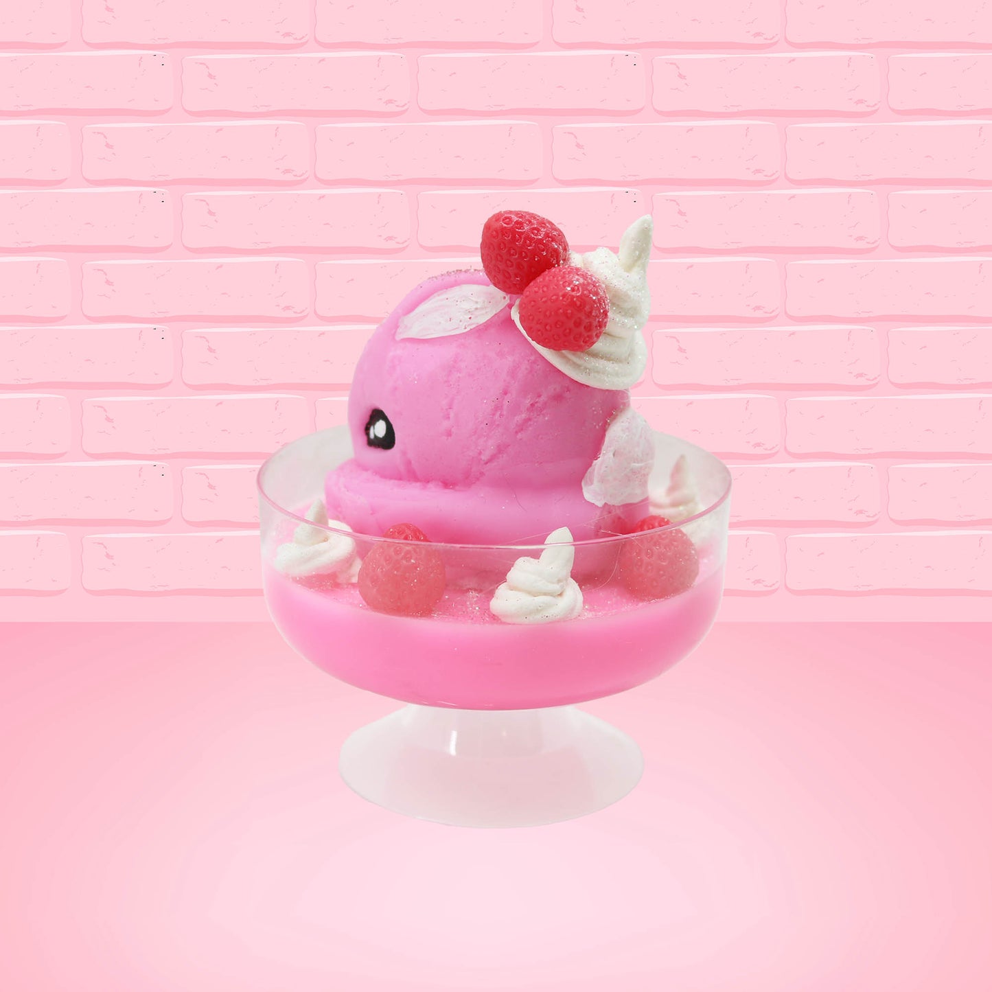 Cute kawaii bunny Pink Swirl Cotton Candy pink ice cream sundae with strawberries and swirls of whipped cream in the dish. The bunny has two strawberries near the swirl of whipped cream on top and white glitter.  This view is from the back with a slight angle.