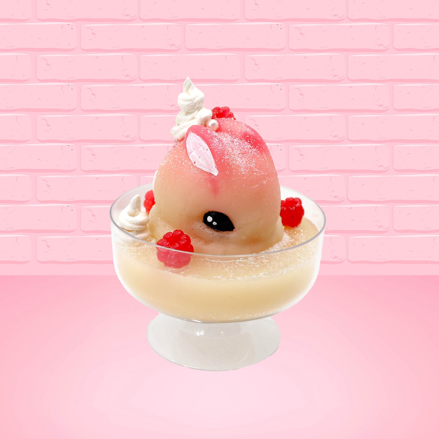 Cute kawaii bunny raspberry cheesecake white ice cream with raspberries and whipped cream swirls in the dish. The bunny has two raspberry on the back near the swirl of whipped cream and covered with white glitter. This view is from the front at an angle.