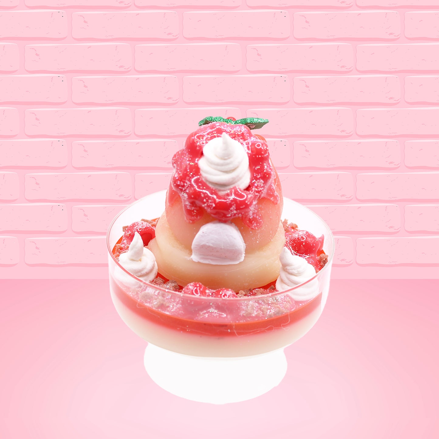 Cute kawaii bunny Santa Cookie Crumble white ice cream sundae with red glaze, glitter, red berries and whipped swirls in the dish. The bunny has red berries and green leaves on top with red translucent glaze near the whipped cream swirl. This view is from the back.