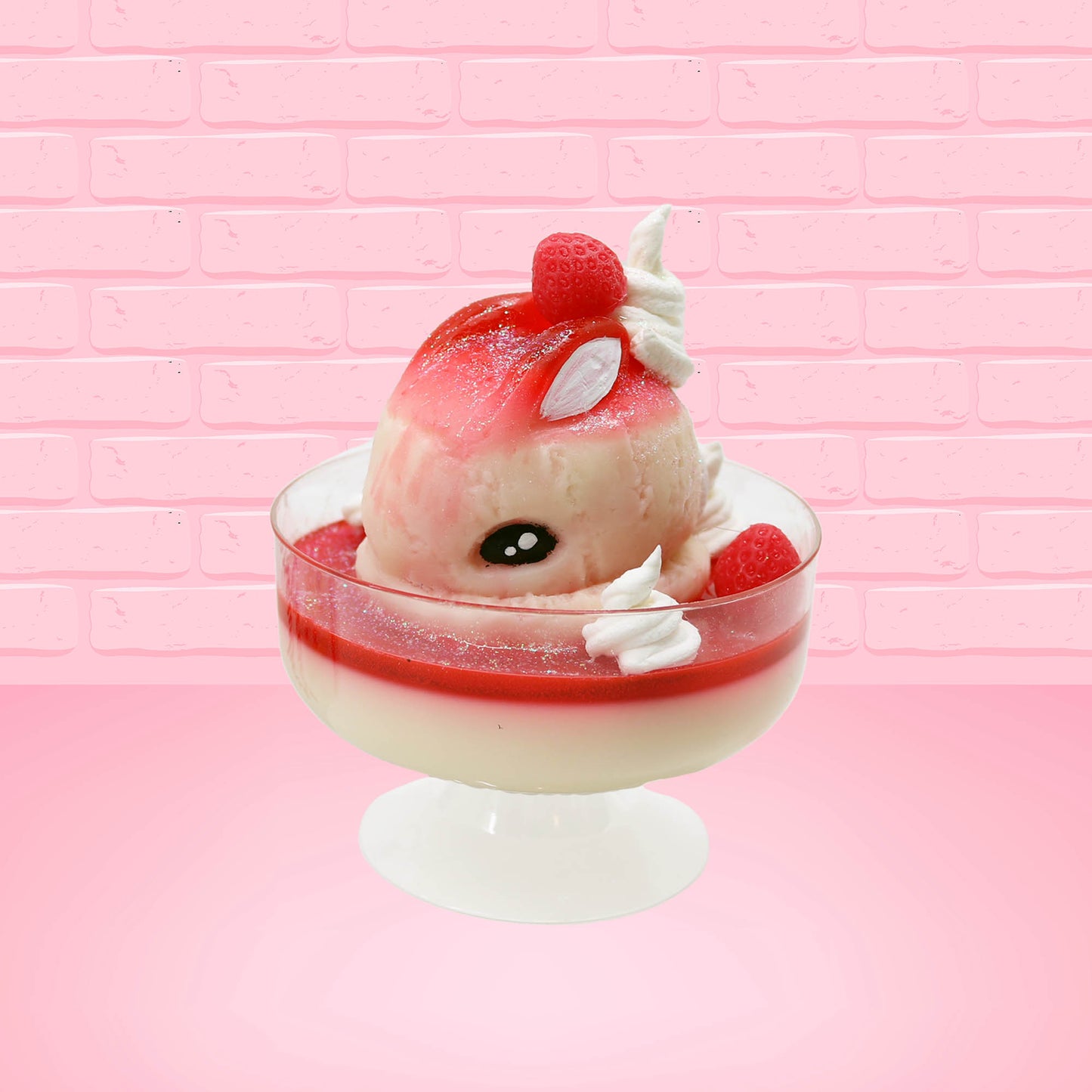 Cute kawaii bunny strawberry cheesecake white ice cream with red glaze, strawberries, and whipped cream swirls in the dish. The bunny has a strawberry on top between the ears, with a swirl of whipped cream on the back. This view is from the front at an angle.
