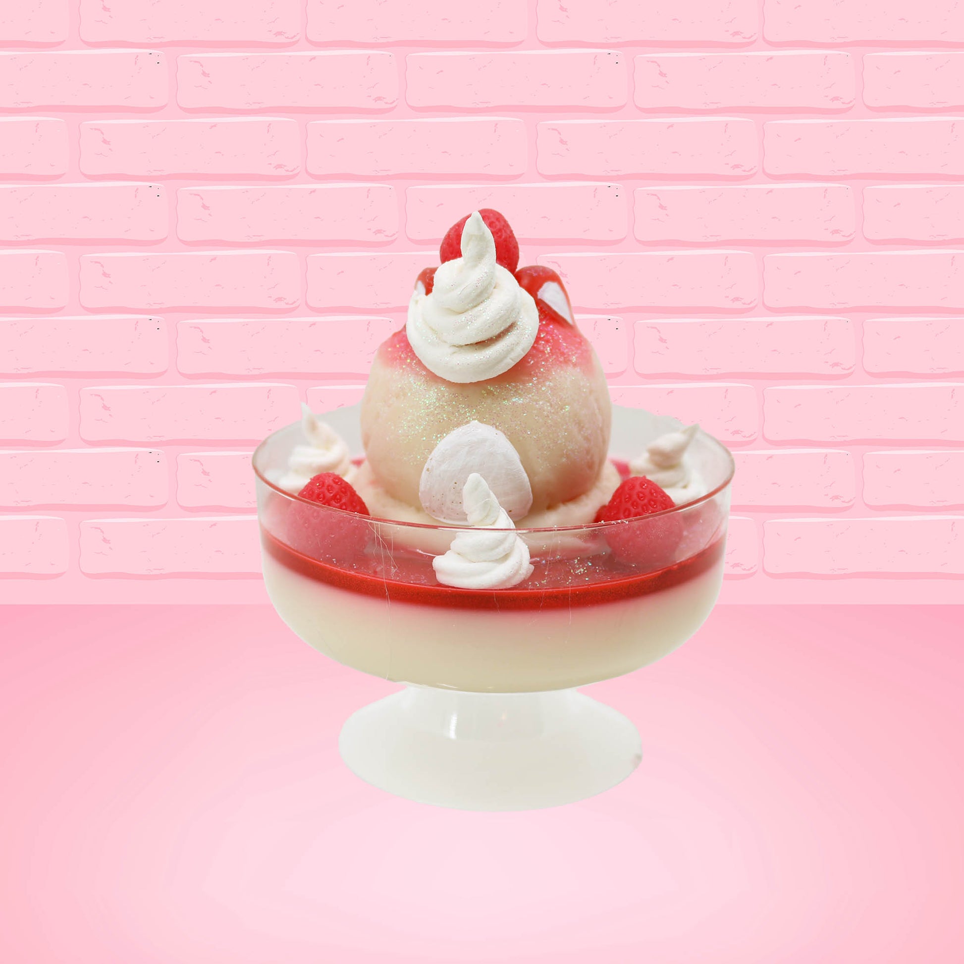 Cute kawaii bunny strawberry cheesecake white ice cream with red glaze, strawberries, and whipped cream swirls in the dish. The bunny has a strawberry on top between the ears, with a swirl of whipped cream on the back. This view is from the back.