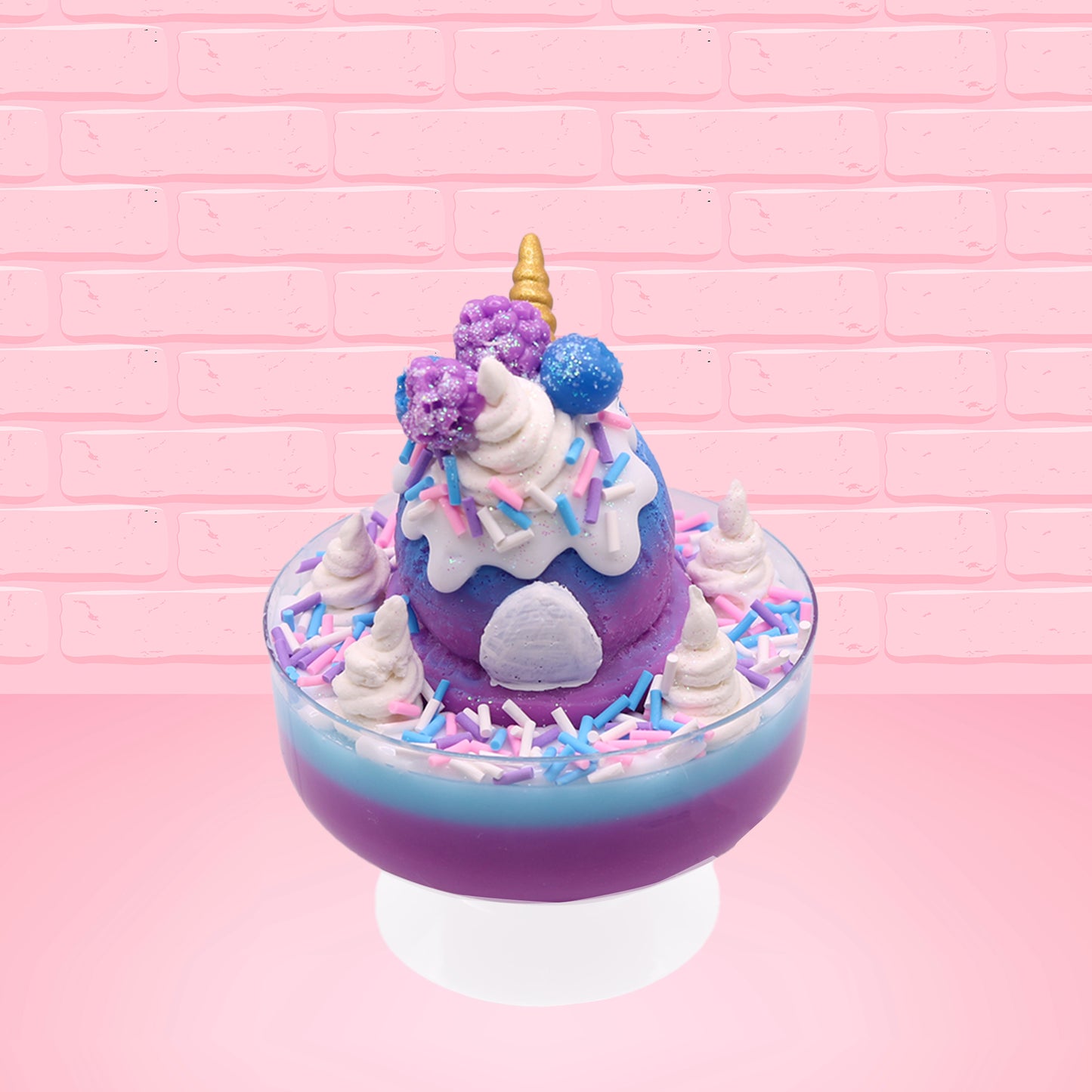 Cute kawaii unicorn bunny ice cream Sugar Berry Twilight sundae with whipped cream swirls, pink, blue, and white sprinkles in the dish. The unicorn bunny is purple and blue on top with blue berries and light purple raspberries, with a whipped cream swirl. This view is from the back.