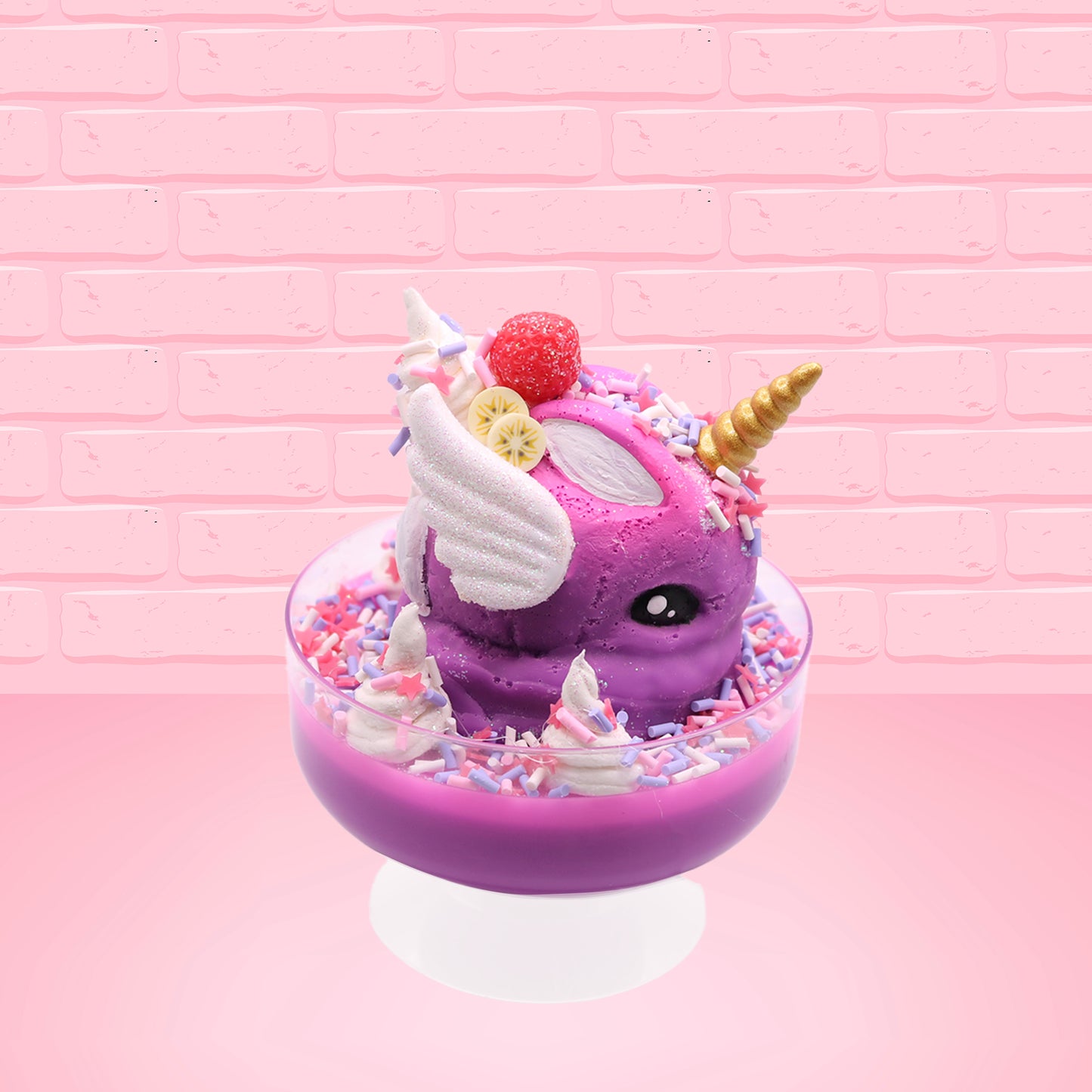 Cute kawaii unicorn purple and pink ice cream sundae with whipped cream swirls, purple, pink, white, and red star sprinkles in the dish. This unicorn bunny has white wings with a strawberry, banana slices and sprinkles on top near the whipped cream. This view is from the other side. 