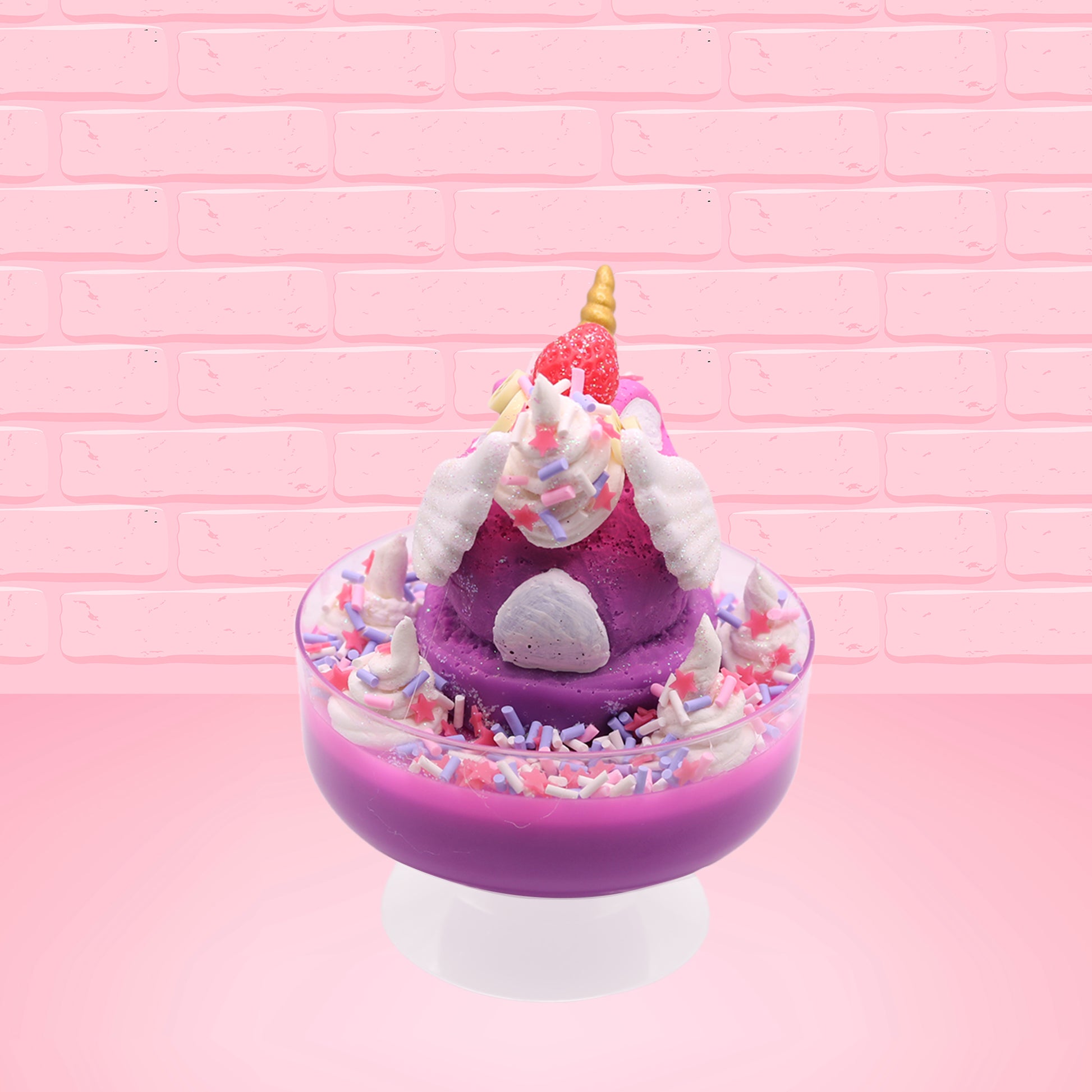 Cute kawaii unicorn purple and pink ice cream sundae with whipped cream swirls, purple, pink, white, and red star sprinkles in the dish. This unicorn bunny has white wings with a strawberry, banana slices and sprinkles on top near the whipped cream. This view is from the back. 