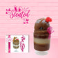 Cute kawaii bunny tall brown Hot Fudge ice cream sundae with glitter and raspberries on top with the whipped cream swirl. The bunny has white pearls and a pink ribbon, along with the front card and the word scented. 