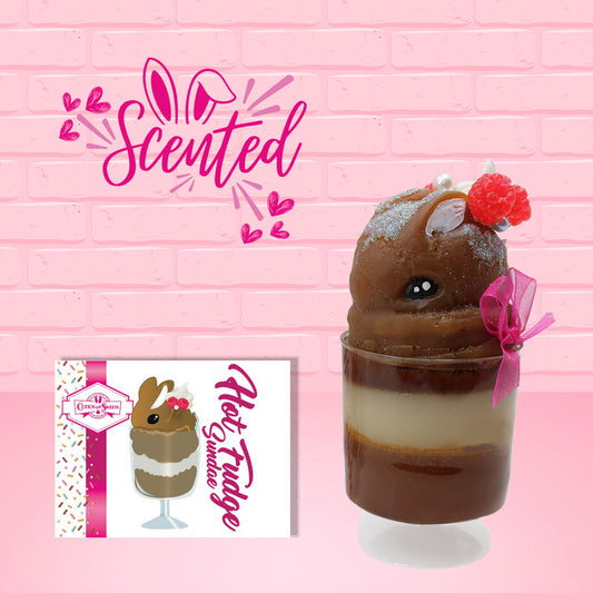 Cute kawaii bunny tall brown Hot Fudge ice cream sundae with glitter and raspberries on top with the whipped cream swirl. The bunny has white pearls and a pink ribbon, along with the front card and the word scented. 