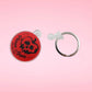 Close up of the Poison Apple keychain separated from key ring.
