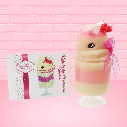 Cute kawaii bunny Raspberry Cheesecake white tall sundae with raspberries and a whipped cream swirl on top and a pink bow on the side. The bunny has glittery pink ears. The front of the character card is shown.
