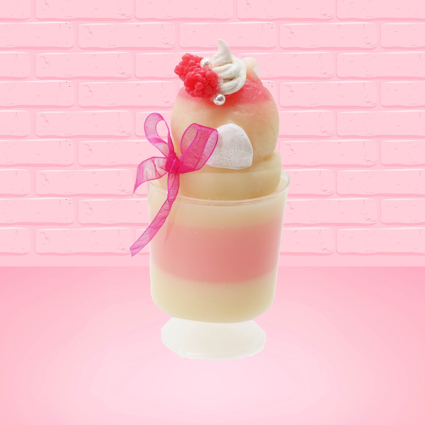 Cute kawaii bunny Raspberry Cheesecake white tall sundae with raspberries and a whipped cream swirl on top and a pink bow on the side. The bunny has glittery pink ears. This view is from the back.