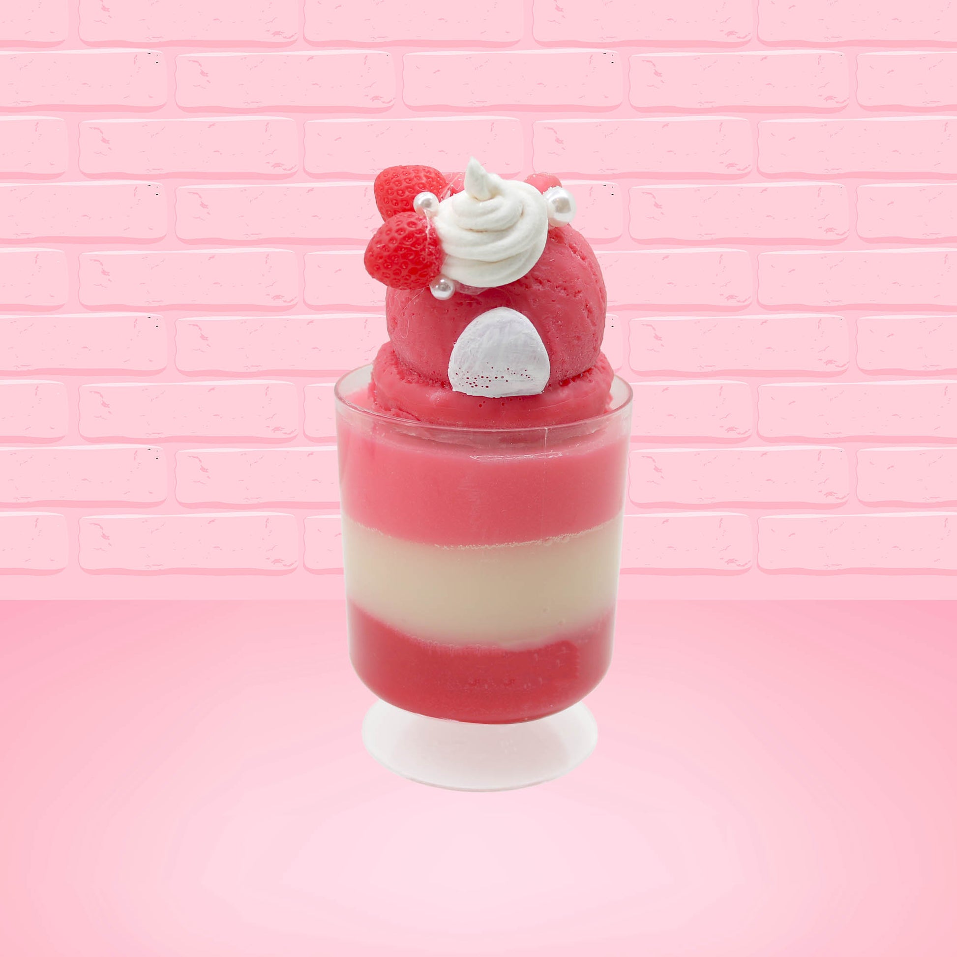 Cute kawaii bunny tall Strawberry Parfait Sundae red ice cream with strawberries, a pearl, and a whipped cream swirl on the top of the bunny. This view is from the back.