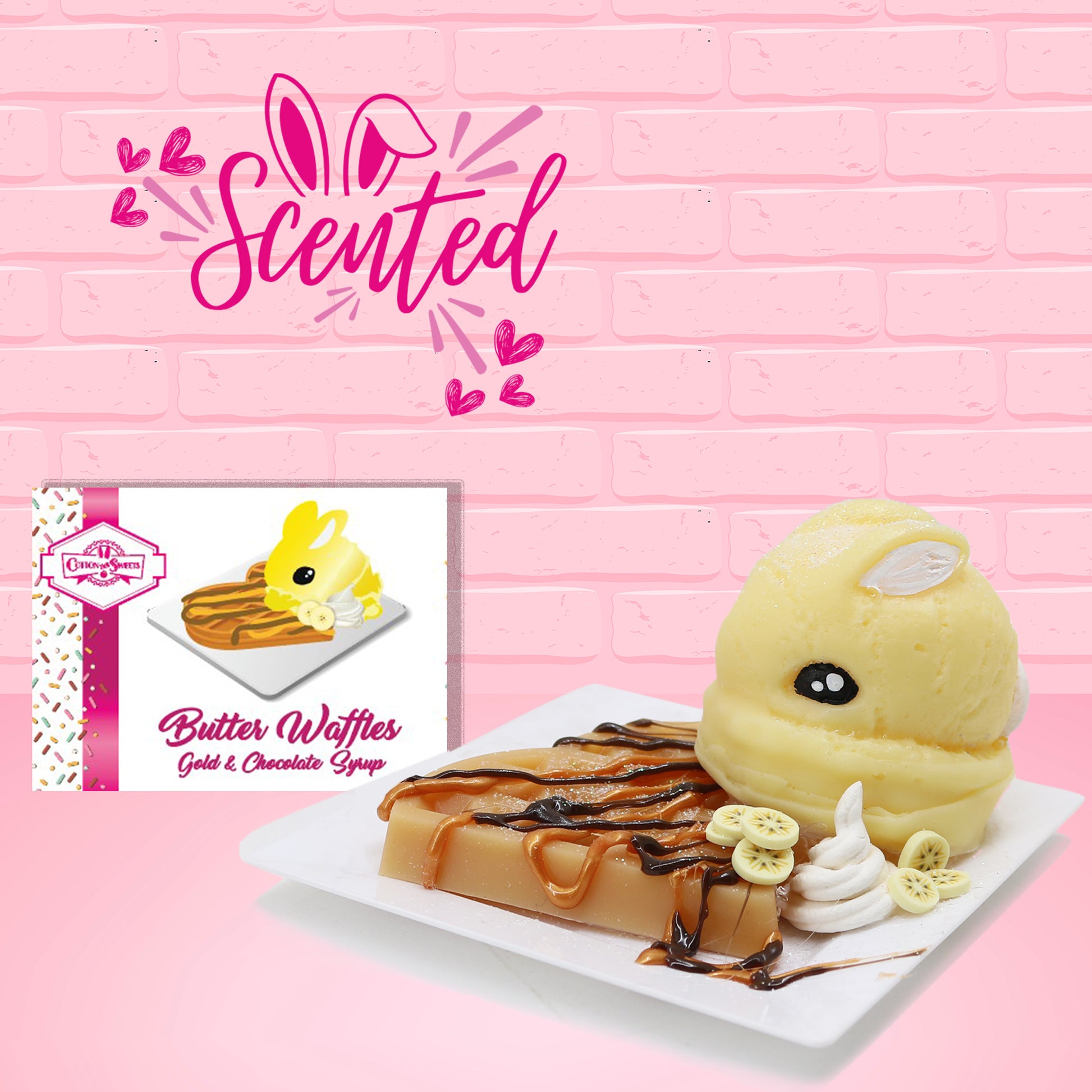 Cute kawaii butter bunny with gold and chocolate drizzles on a waffle, with banana slices on a square plate. The front of the character card is shown as well as the word scented.