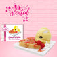 Cute kawaii buttery bunny on top of a waffle with gold and red drizzles, red strawberries, on top of a square plate. The front of the character card is shown as well as the word scented. 