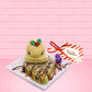 The front of the figure is shown with a sign “I’m all toasty inside for Christmas.”