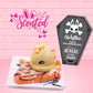 Cute kawaii buttery bunny on top of a orange waffle with black and white drizzles, candy corn, and a pumpkin charm. The sign reads Waffles This is Halloween Spice Beware if you date.