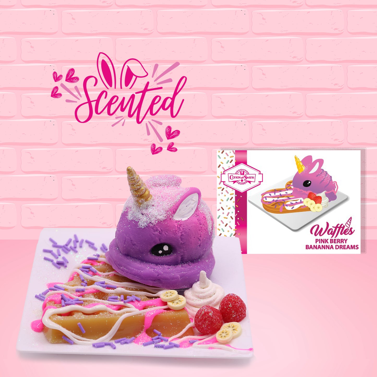 Cute kawaii purple bunny unicorn with white glitter on top of a brown waffle with pink and purple drizzles, banana slices, and raspberries on top of a square plate. The front of the character card is shown as well as the word scented.
