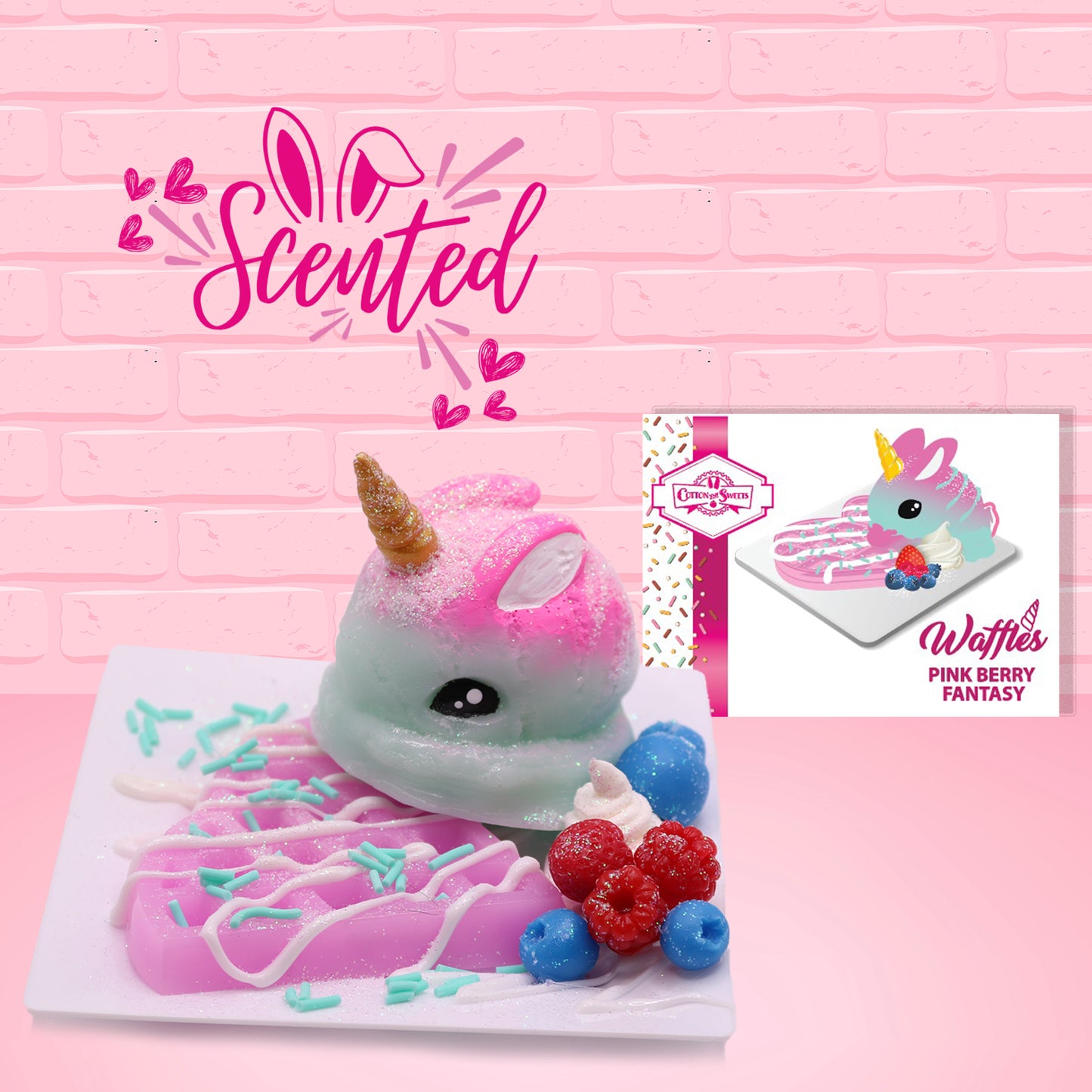 Cute kawaii blue and pink bunny unicorn on top of a pink waffle with white drizzle and blue sprinkles on top of a square plate. Red raspberries and blueberries are on the plate as well. The front of the character card is shown as well as the word scented. 